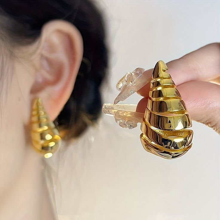 ‏Gold bottega veneta earrings
.